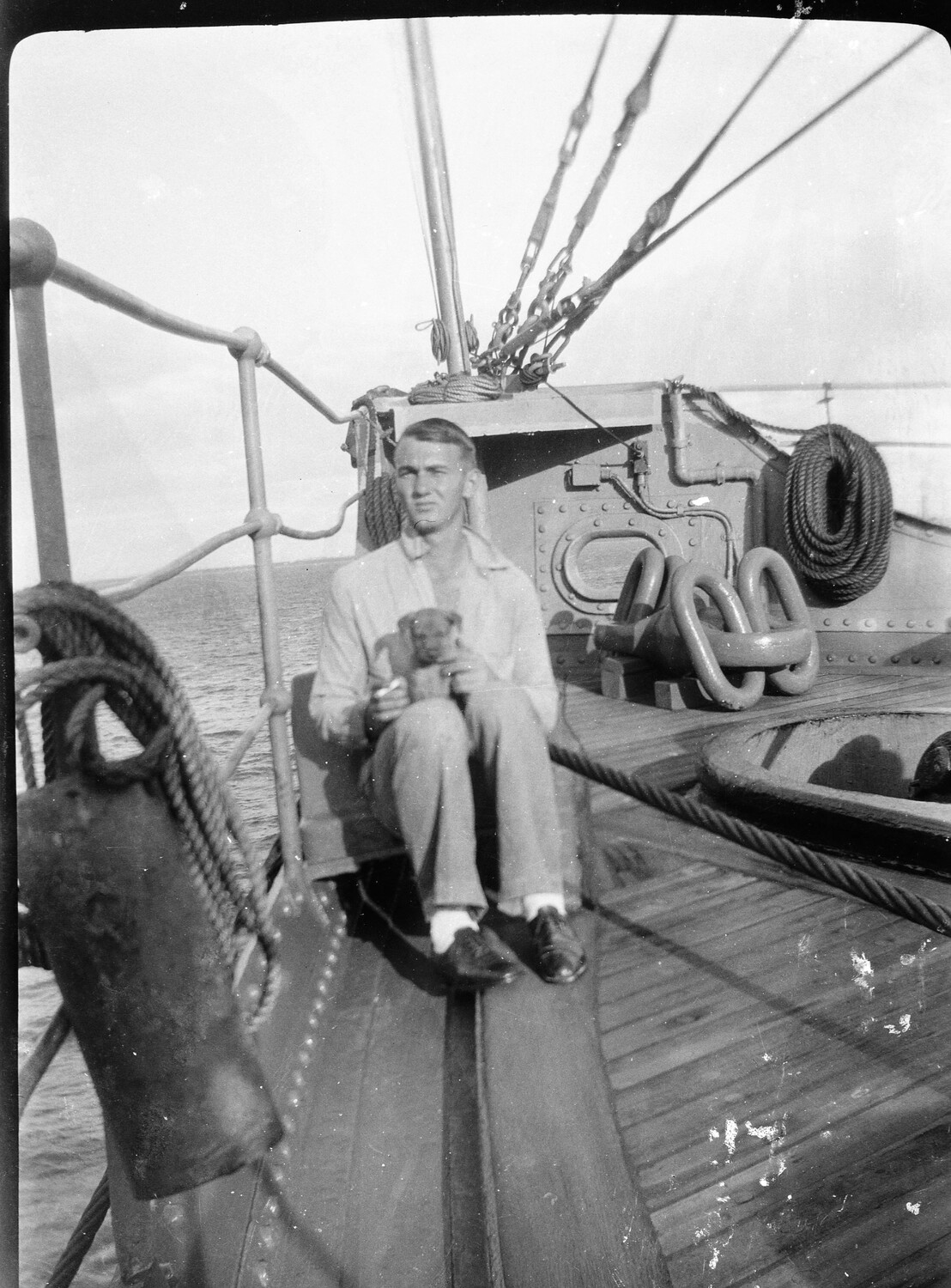 Sailor with Puppy on Ship's Bow, U.S. Asiatic Fleet, China Station, 1930s