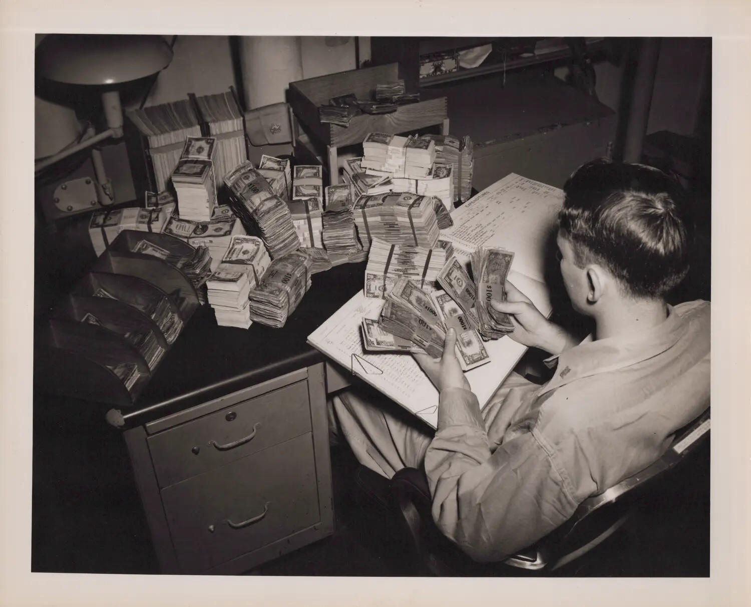 Navy Disbursing Clerk Counting Currency Aboard Ship, WWII