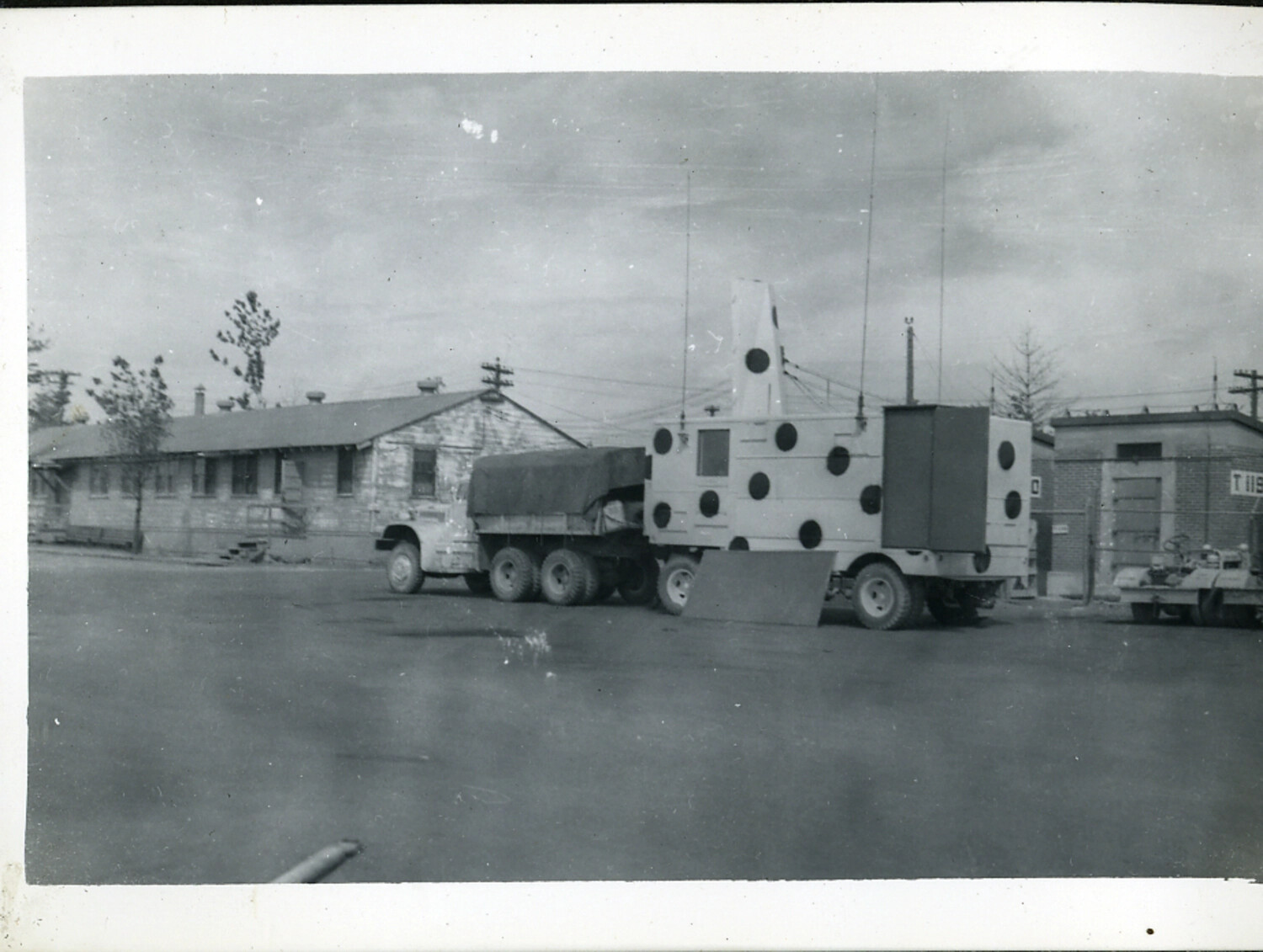 Military Truck Towing Mobile Radar/Communications Shelter, U.S. Army Installation, Japan, Post-WWII Era