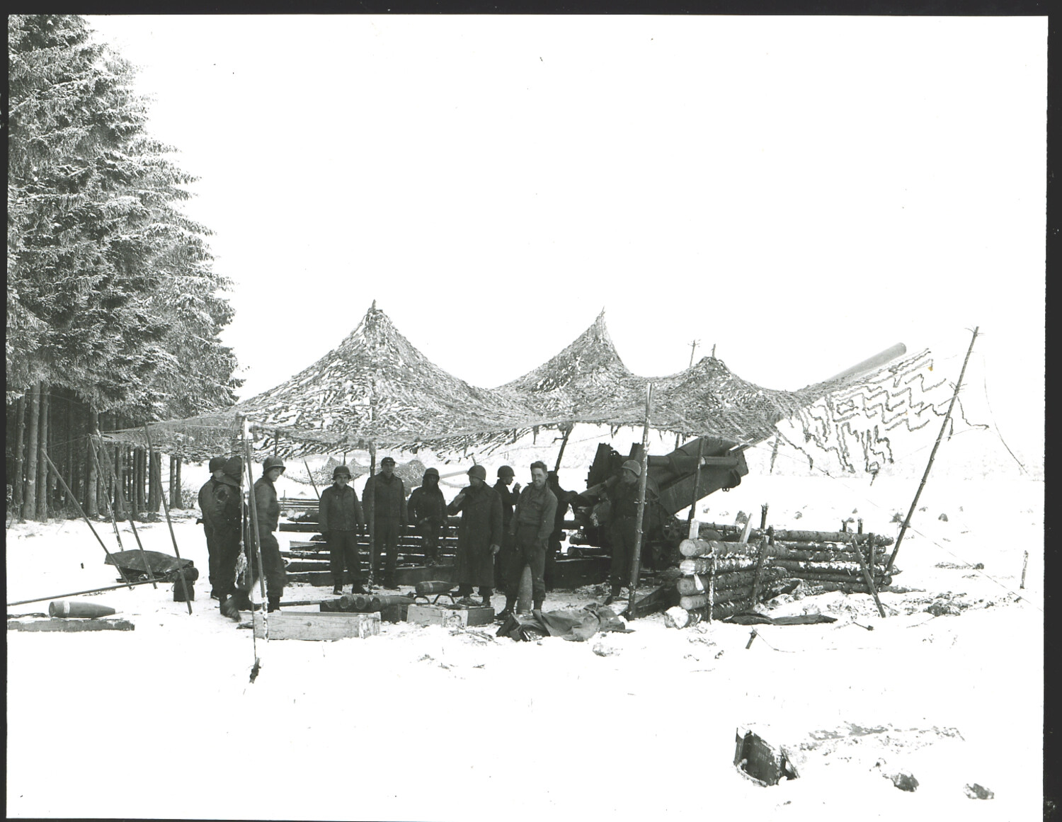 155mm Howitzer Position Under Camouflage Netting in Snow, Bastogne Area, Battle of the Bulge, December 1944–January 1945