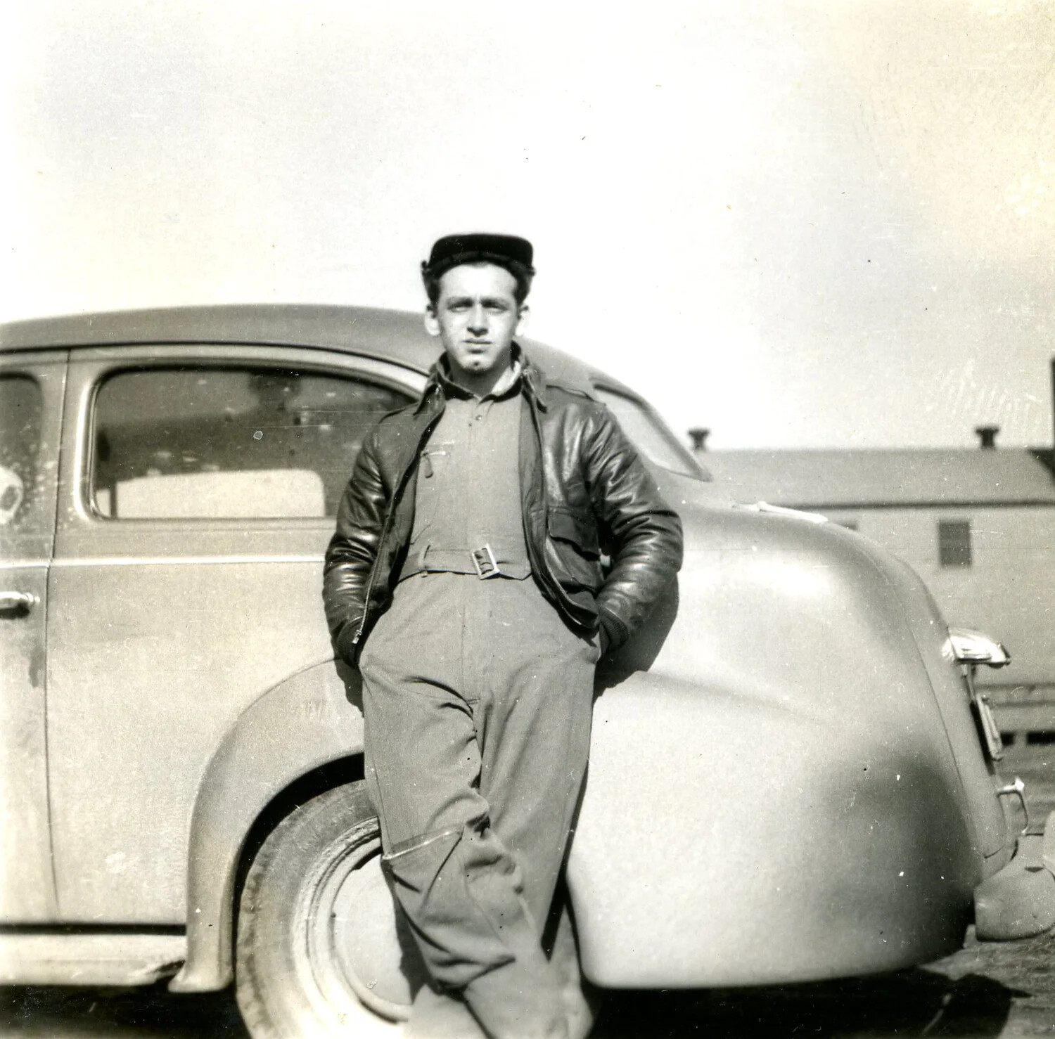 Airman Leaning Against Automobile at Military Base