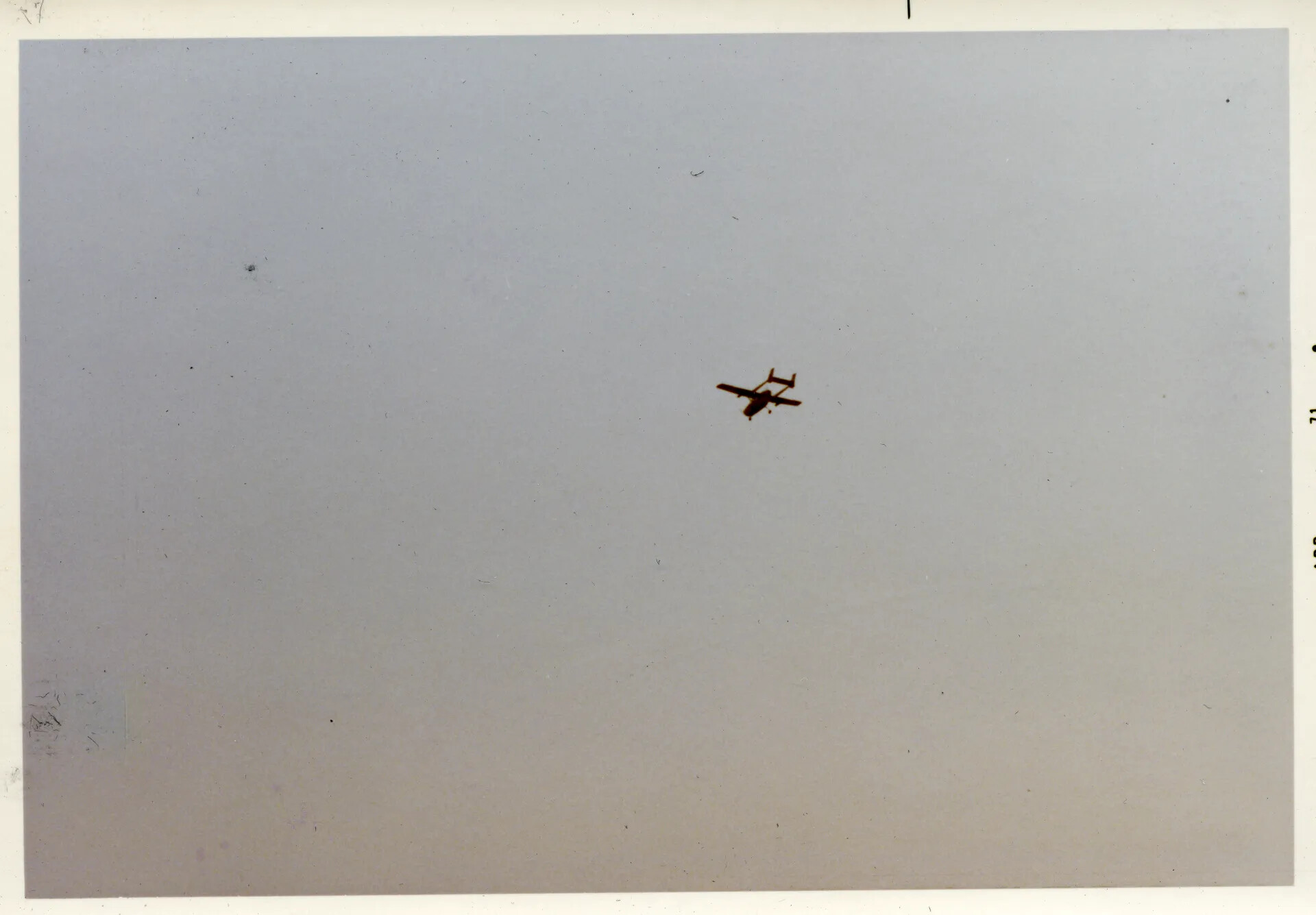 Twin-Boom Aircraft (OV-10 Bronco) in Flight, Southeast Asia, Vietnam War Era