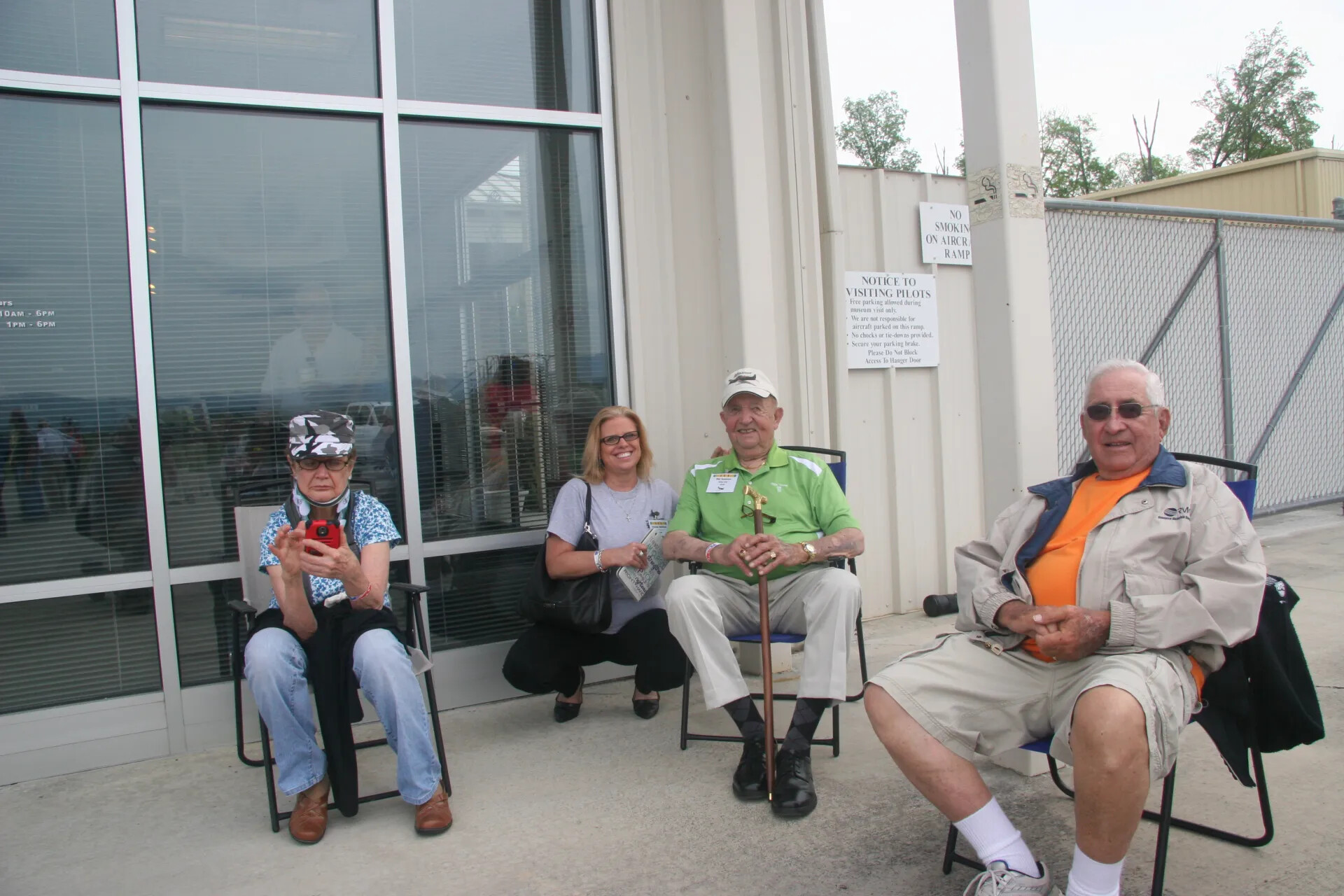 Group Portrait of Veterans and Family Outside Aviation Museum Building, 2016 Reunion Event