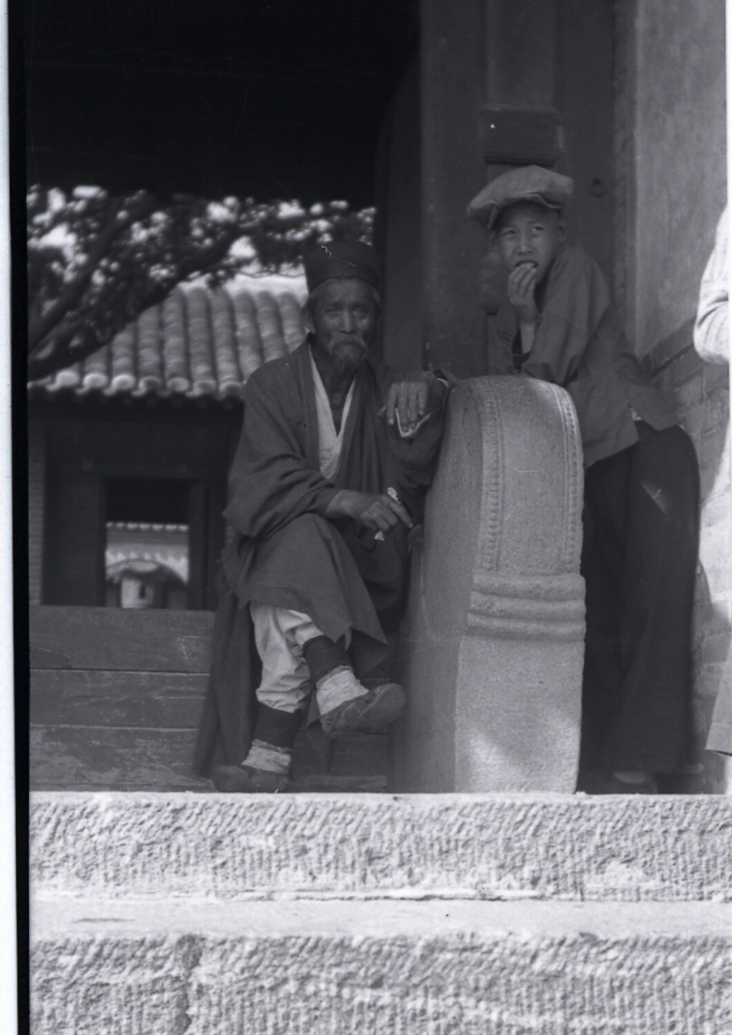 Elderly Man and Boy at a Tibetan Buddhist Temple, Western China
