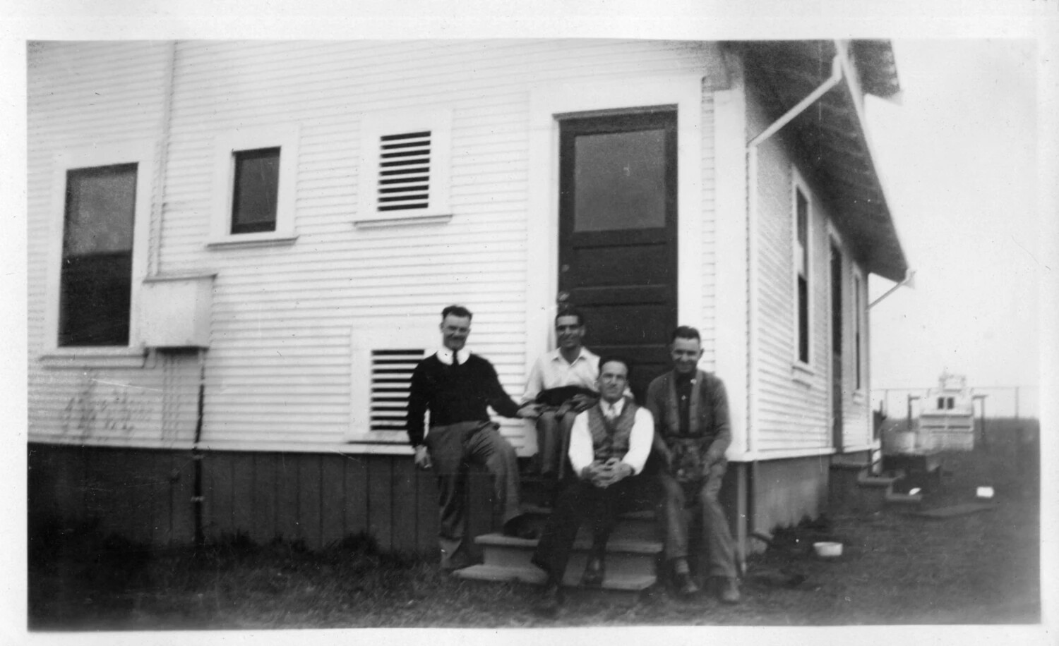 Four Men on the Steps of a Clapboard Building, Presidio Album, c. 1920s-1930s