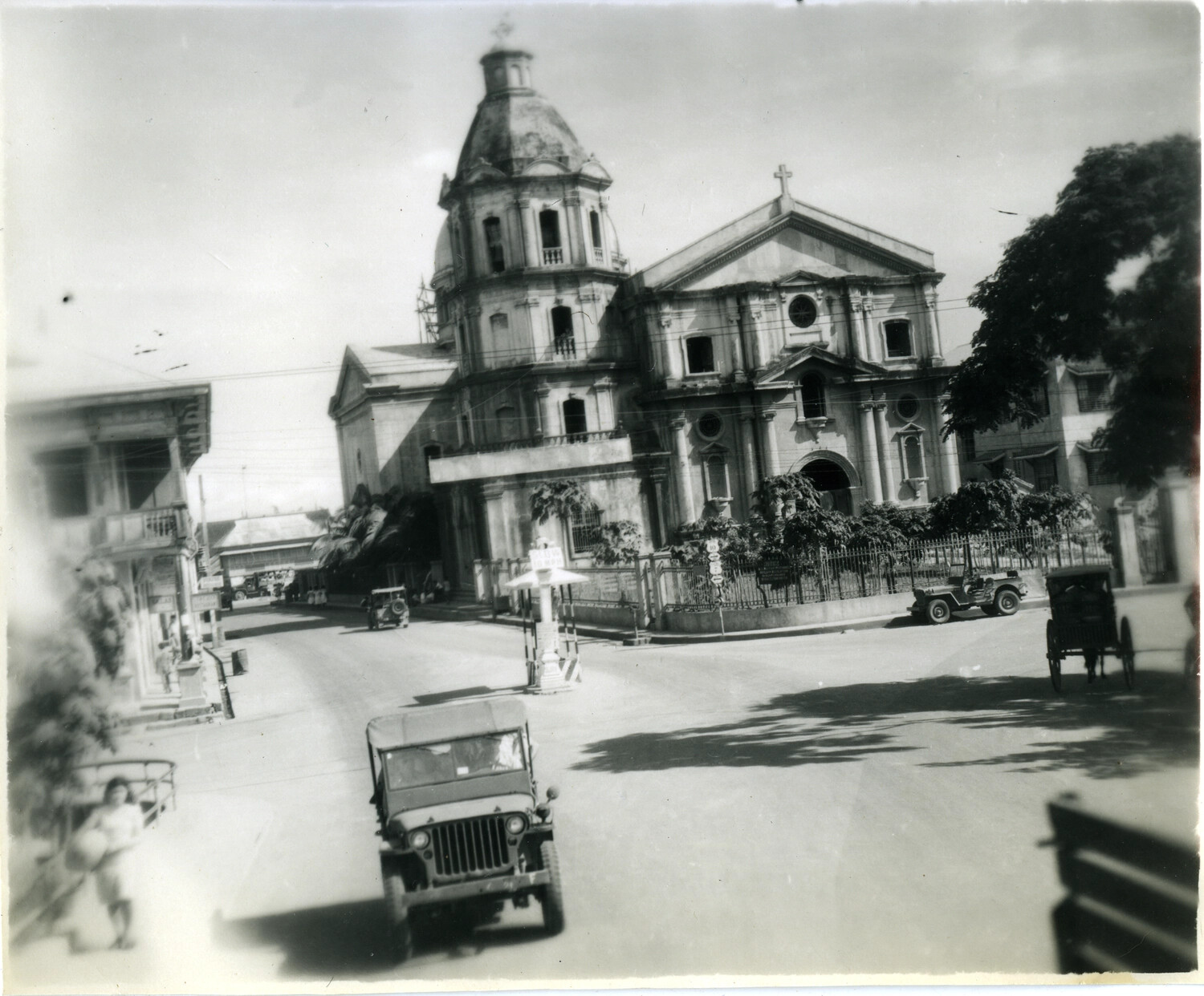 Town Plaza with Spanish Colonial Church and U.S. Military Jeeps