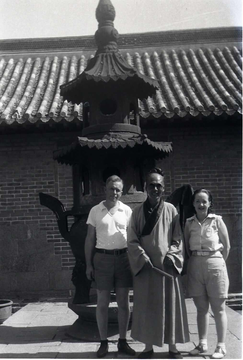 Western Tourists with Buddhist Monk at Temple Incense Burner, China, 1930s