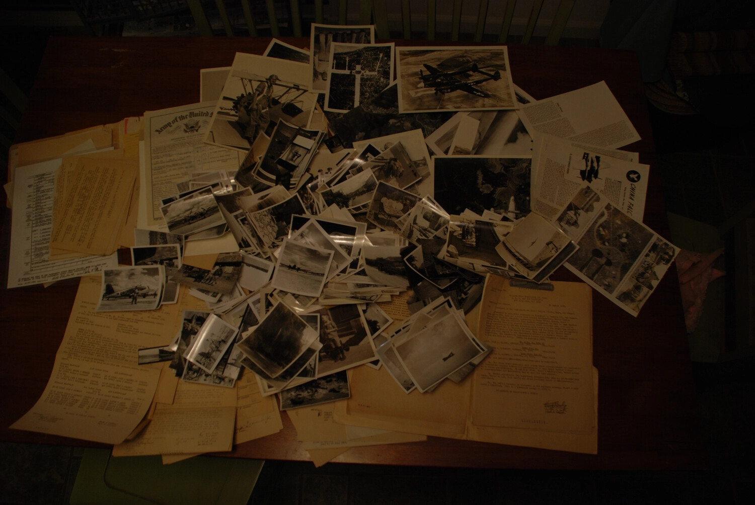 Overview of WWII China-Burma-India Theater Photograph and Document Archive Spread on Table
