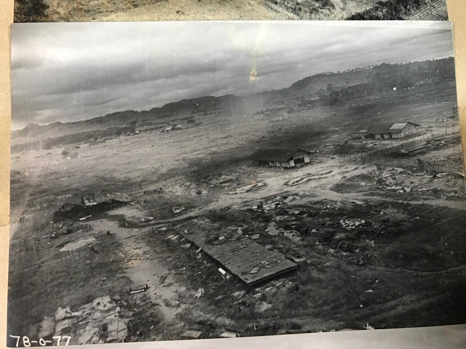 Aerial View of Bomb-Damaged Building Complex Following Air Strike