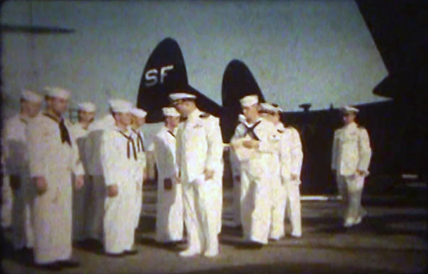 U.S. Navy Personnel Formation Before Aircraft Tail Marked 'SF', NAS Kaneohe Bay, Korean War Era