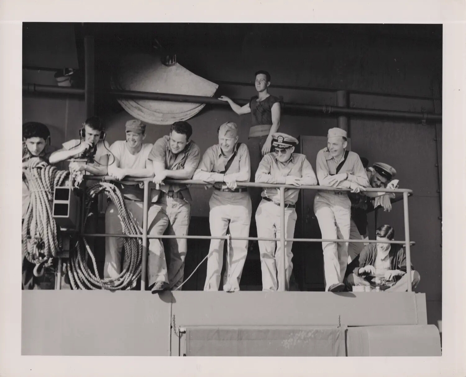 Group Portrait of Sailors and Officer Along Ship's Rail, WWII Era
