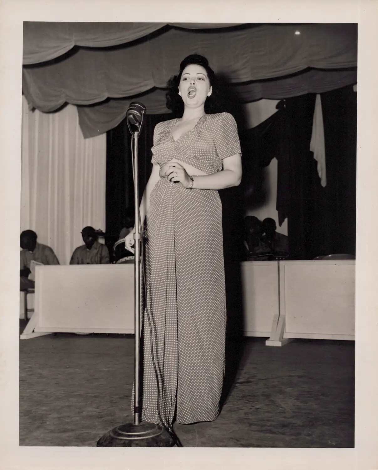 Female Vocalist Performing with Band, WWII Era Stage Show