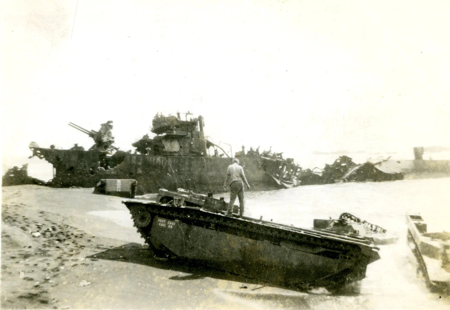 Beached LVT Amtrac 'Don't Cuss Call Us' Beside Wrecked Vessel, Iwo Jima, 1945