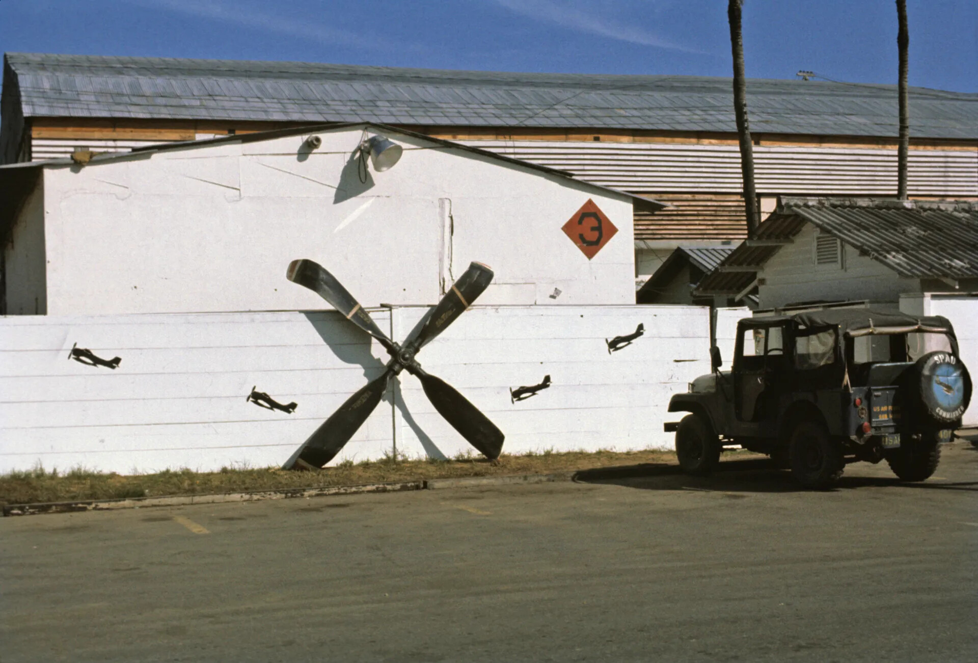 Squadron Building Mural With Crossed Propellers and 'SPAD' Jeep