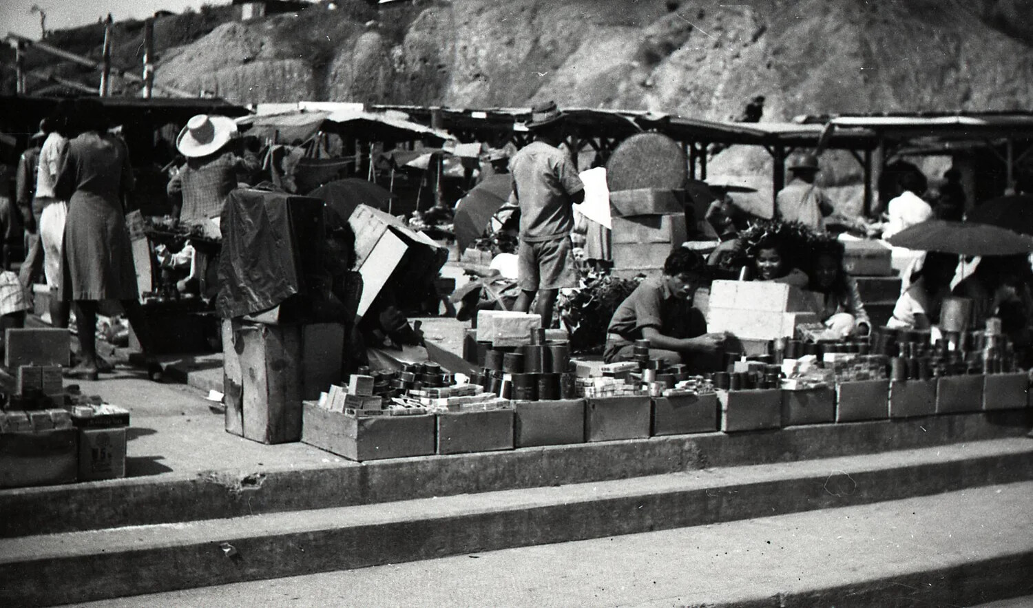 Open-Air Market with Vendors Selling Canned Goods, Luzon, Philippines, WWII Era