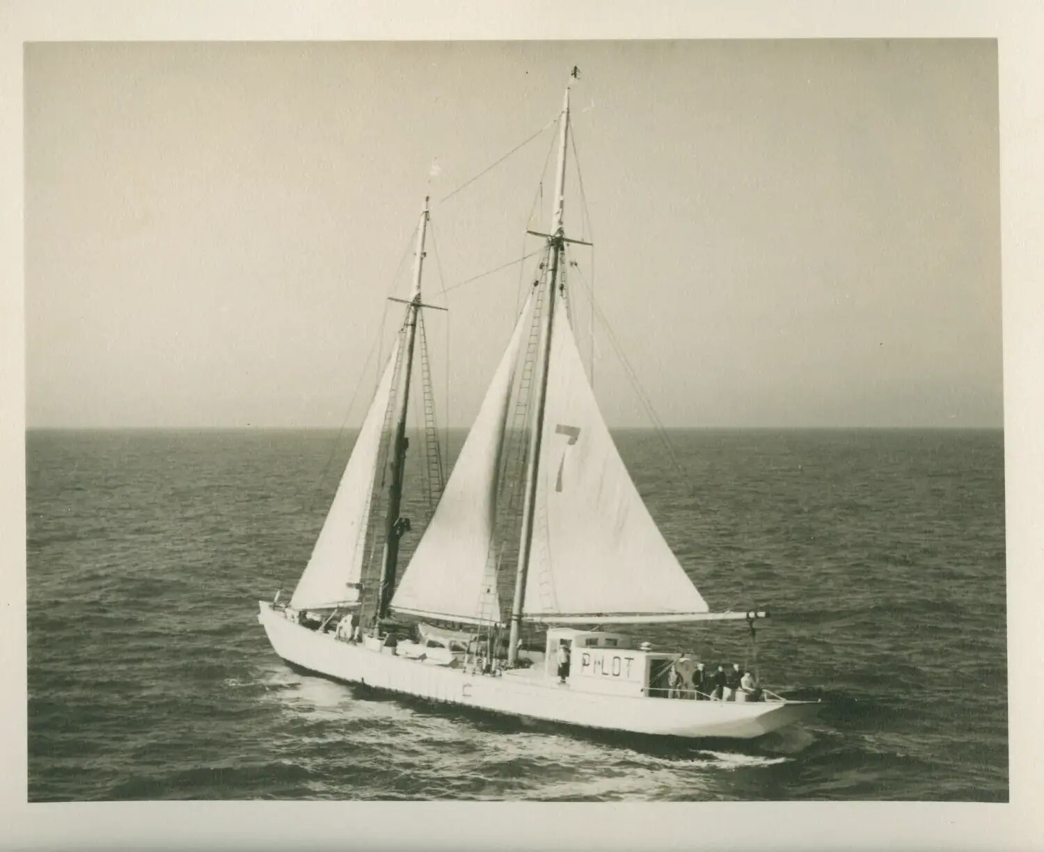 Harbor Pilot Boat No. 7 Under Sail, Photographed from USS Petrof Bay (CVE-80) Aircraft, WWII Era