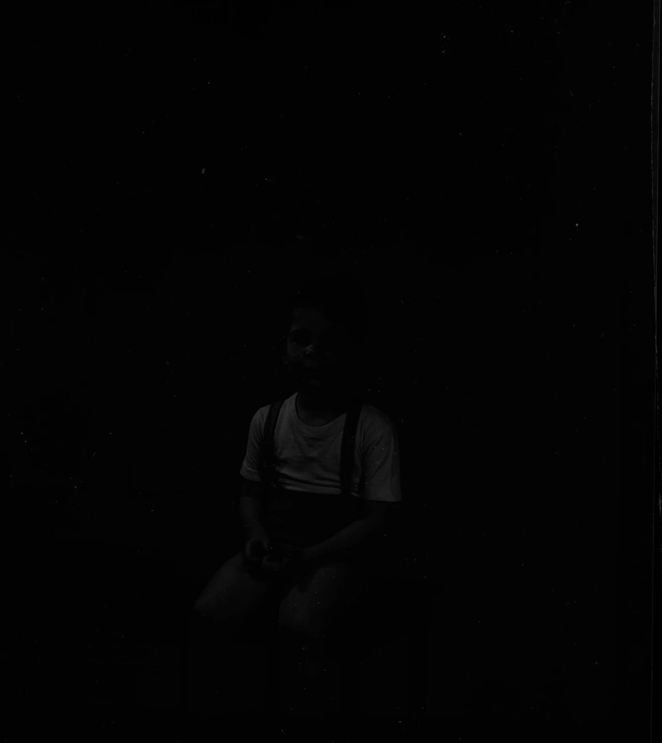 Underexposed Photograph of Seated Boy - Faint Silhouette