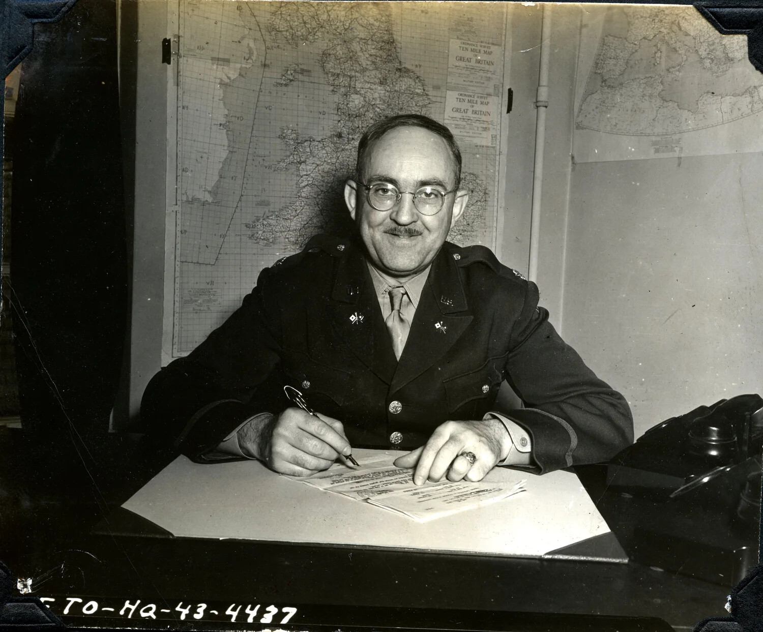 U.S. Army Officer Signing Documents at ETO Headquarters, 1943