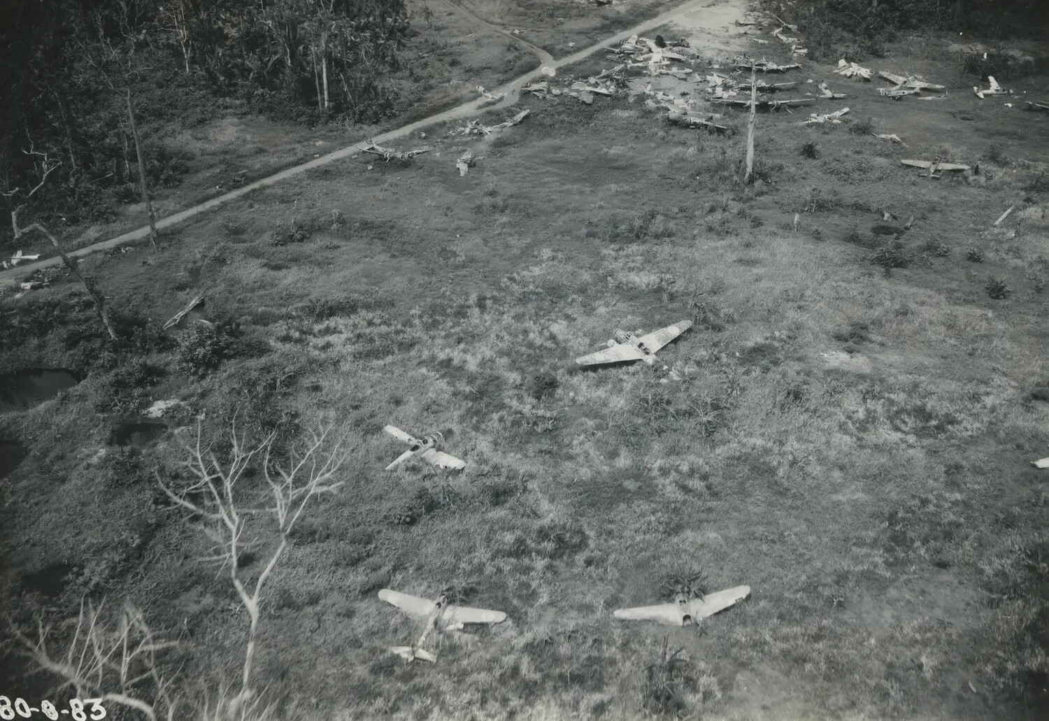 Aerial View of Destroyed Japanese Aircraft at a New Guinea Airfield, World War II Era