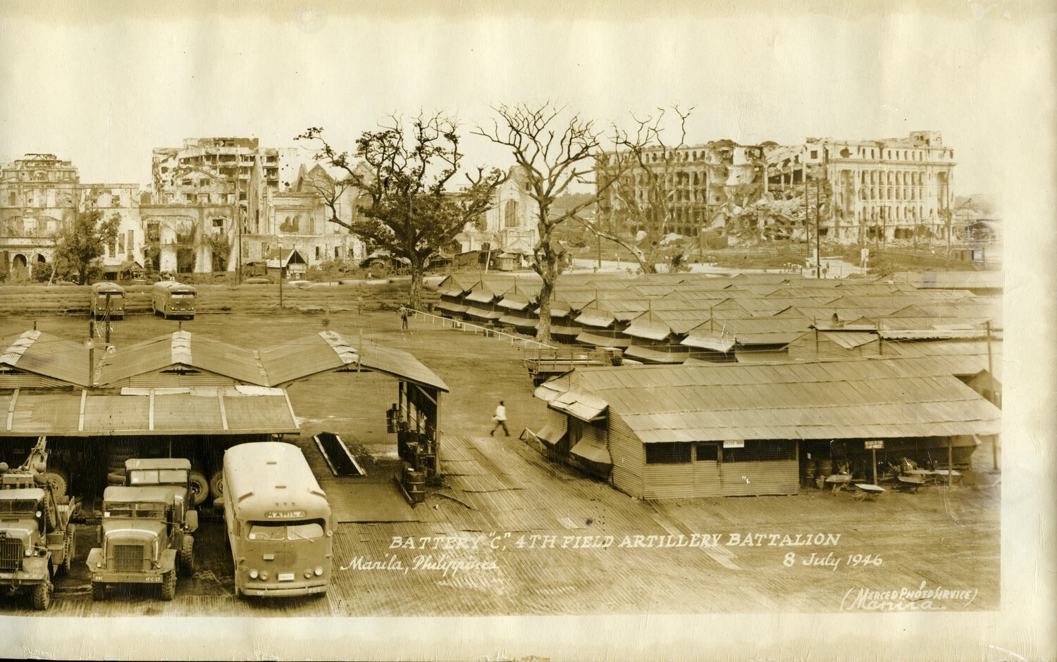 Battery 'C,' 4th Field Artillery Battalion Camp with Ruined Manila Skyline, 8 July 1946