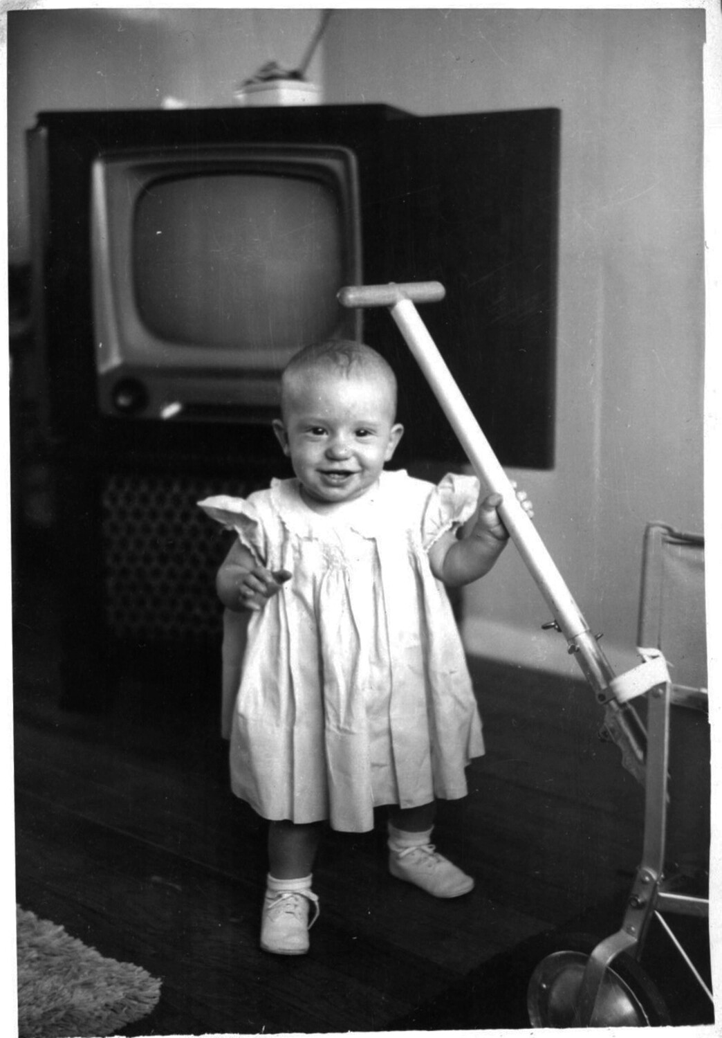 Toddler with Push-Walker Toy in Front of Console Television, Early 1950s