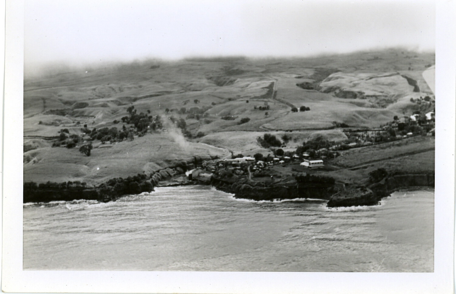 Aerial View of Coastal Village and Grassland Ranchland, Hawaii