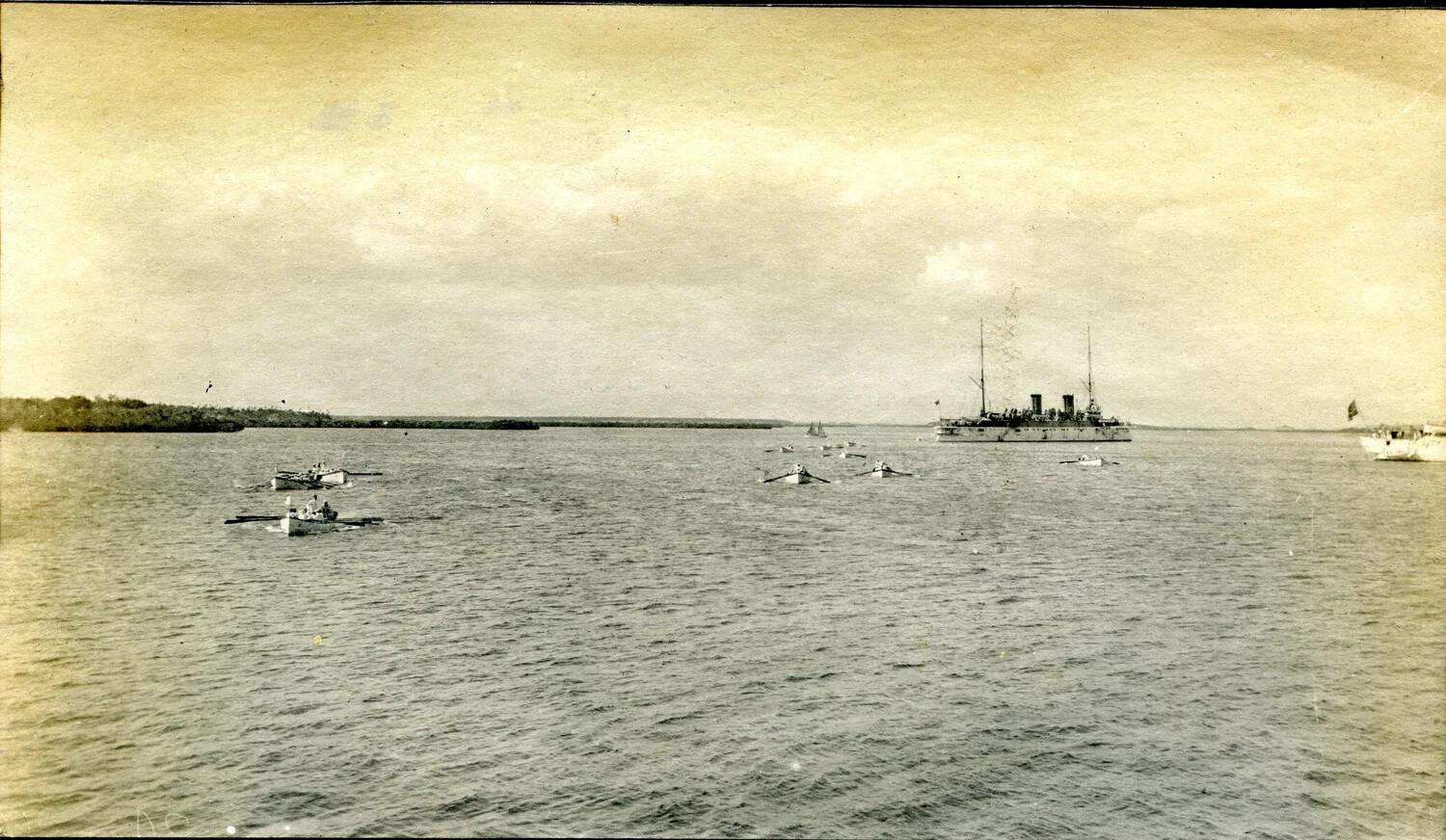 U.S. Navy Protected Cruiser at Anchor with Ship's Boats, Early 20th Century