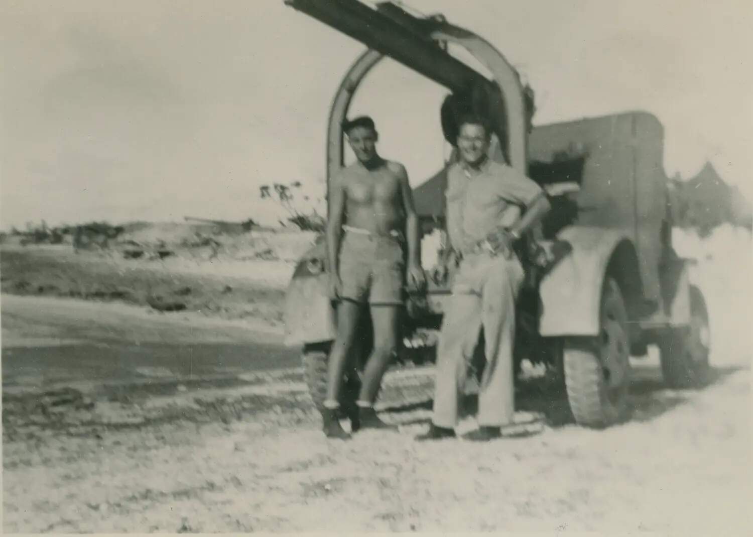 Two Servicemen with a Boom Truck on a Pacific Island Base, WWII Era