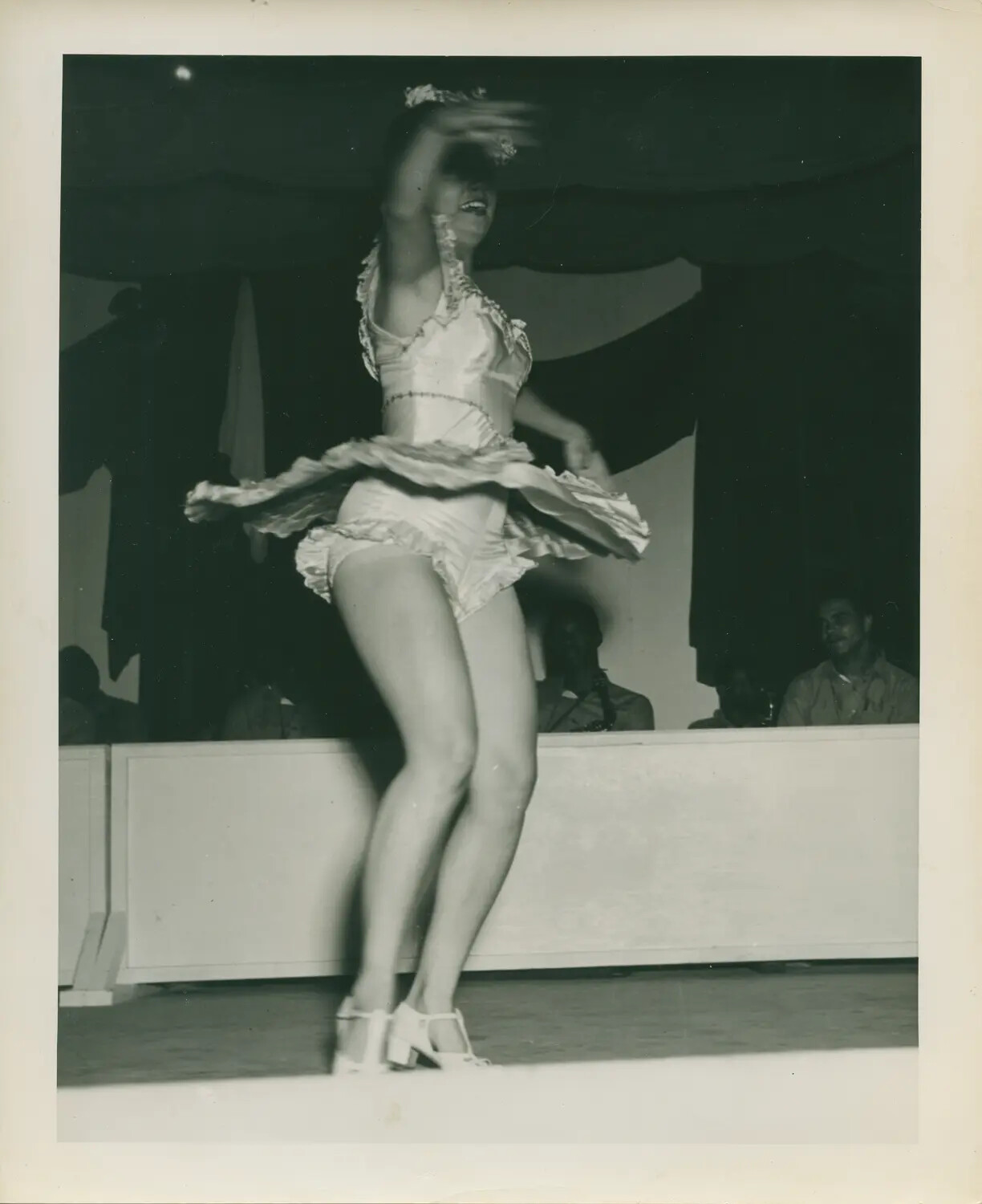 Female Entertainer Performing for Crew, USS Petrof Bay (CVE-80) Collection, World War II Era