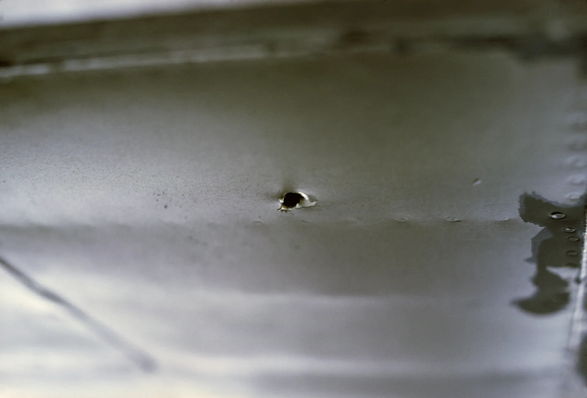 Close-Up of Battle Damage Puncture in Aircraft Skin, Vietnam War Era