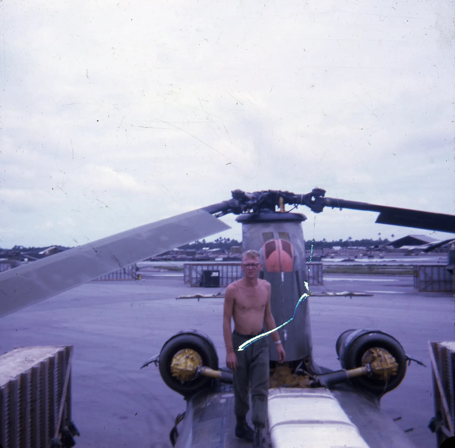 Serviceman Atop Tandem-Rotor Helicopter (CH-47 Chinook type) Rear Pylon, Vietnam