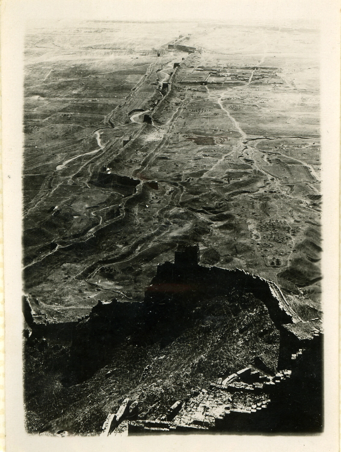 Aerial View of the Great Wall of China Traversing Mountainous Terrain