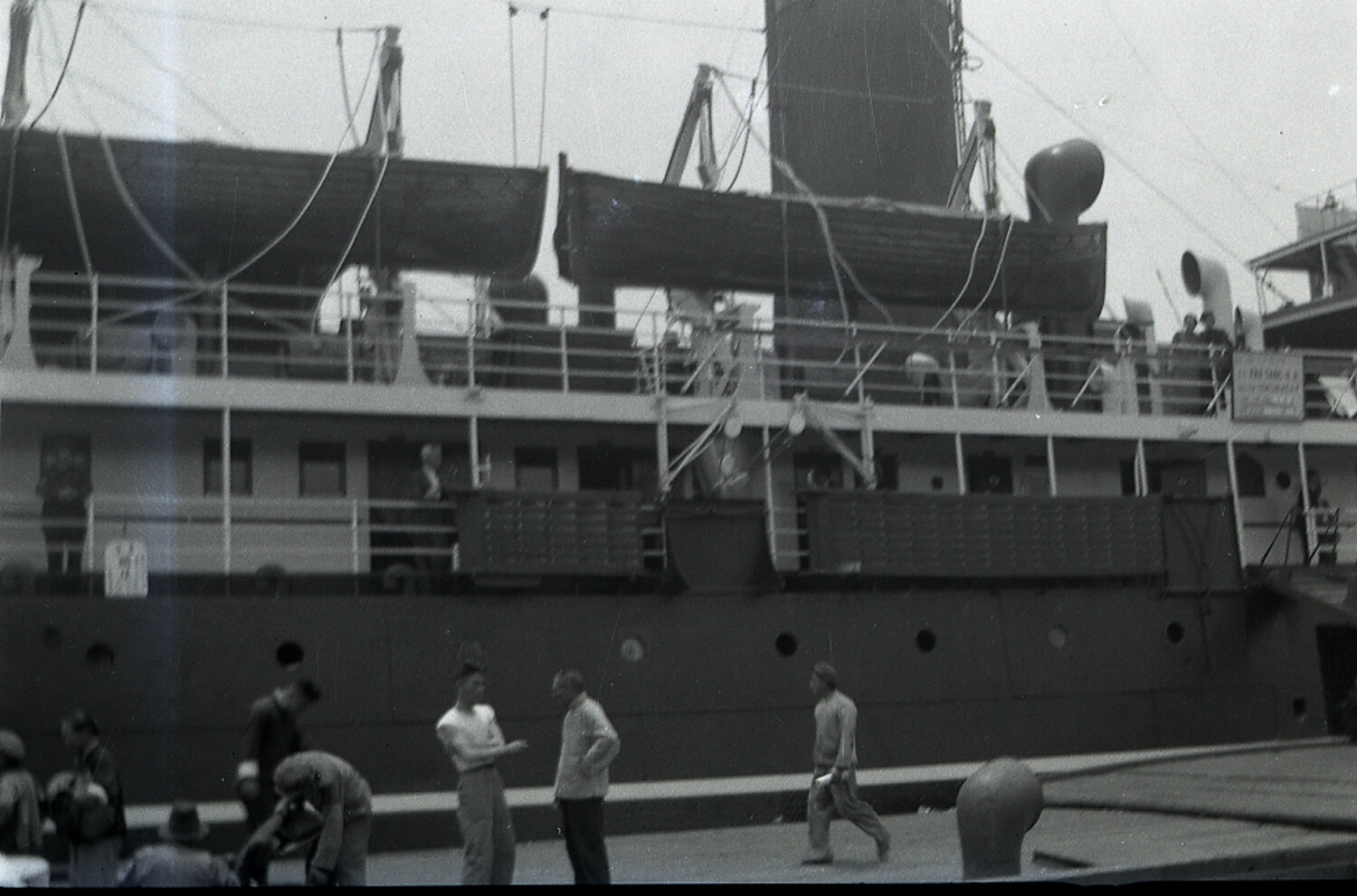 Ocean Liner Moored at Dockside, Lifeboats Swung Out