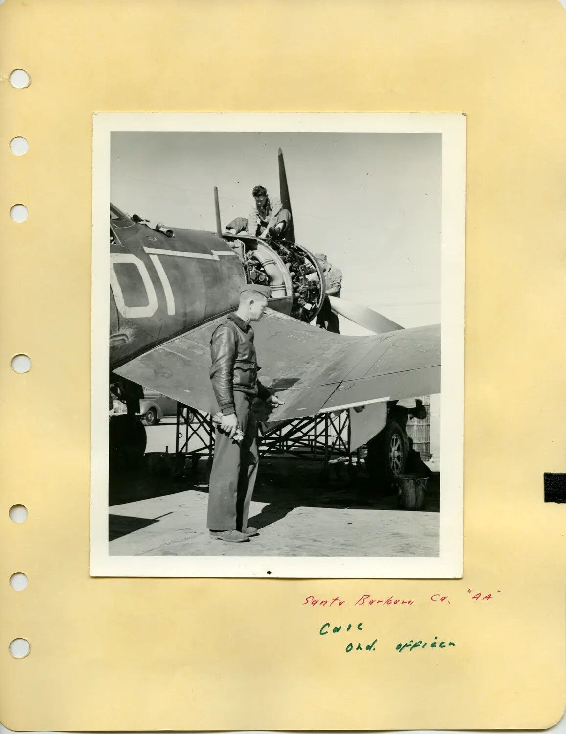U.S. Navy Serviceman Beside Single-Engine Aircraft Undergoing Maintenance, Santa Barbara, California — McAleer Collection