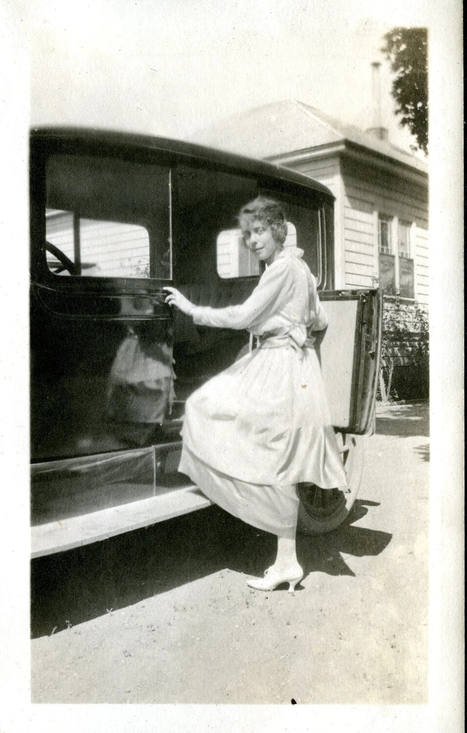 Young Woman Stepping into an Automobile, c. 1922-1926