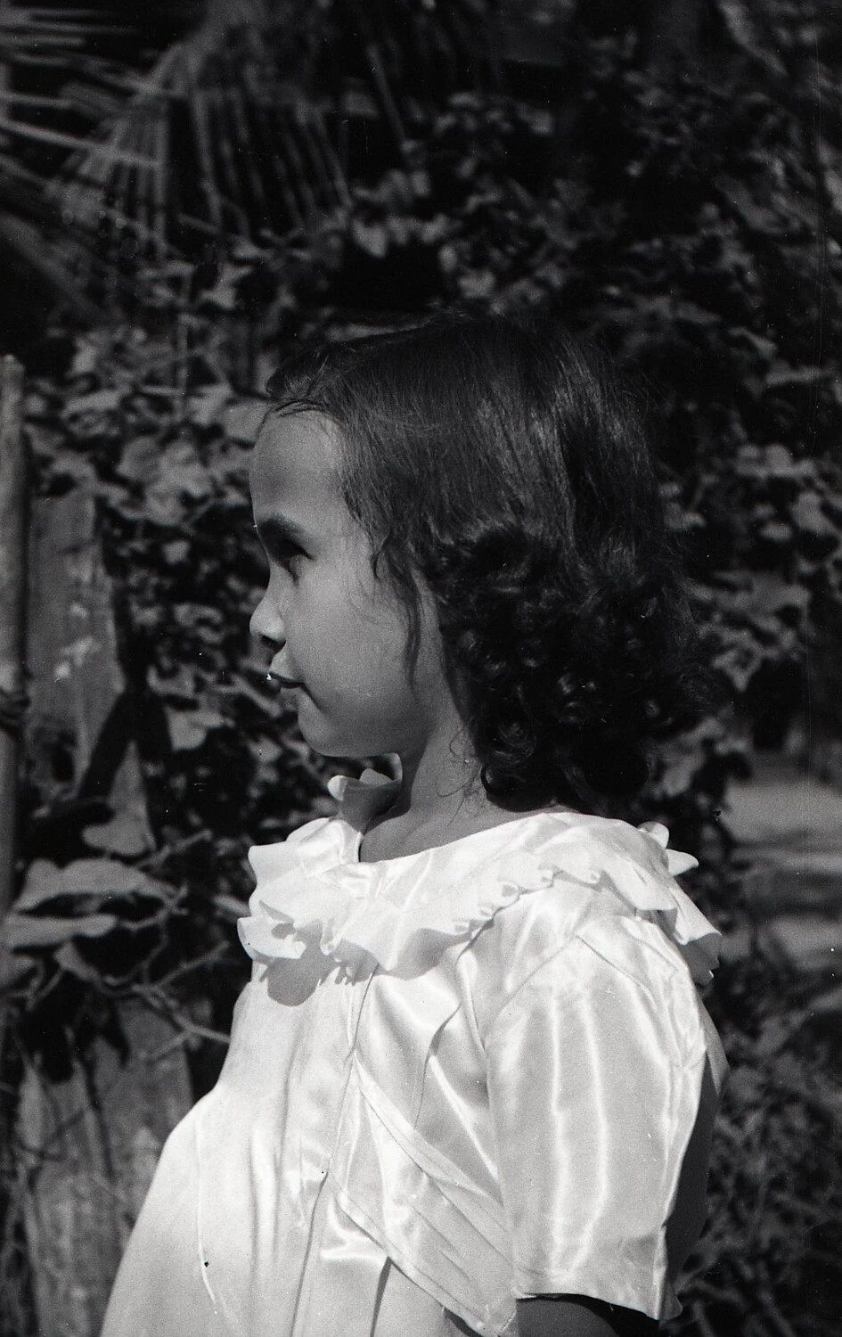 Portrait of a Young Filipino Girl in Profile, Luzon, Philippines, World War II Era (c. 1944-1945)
