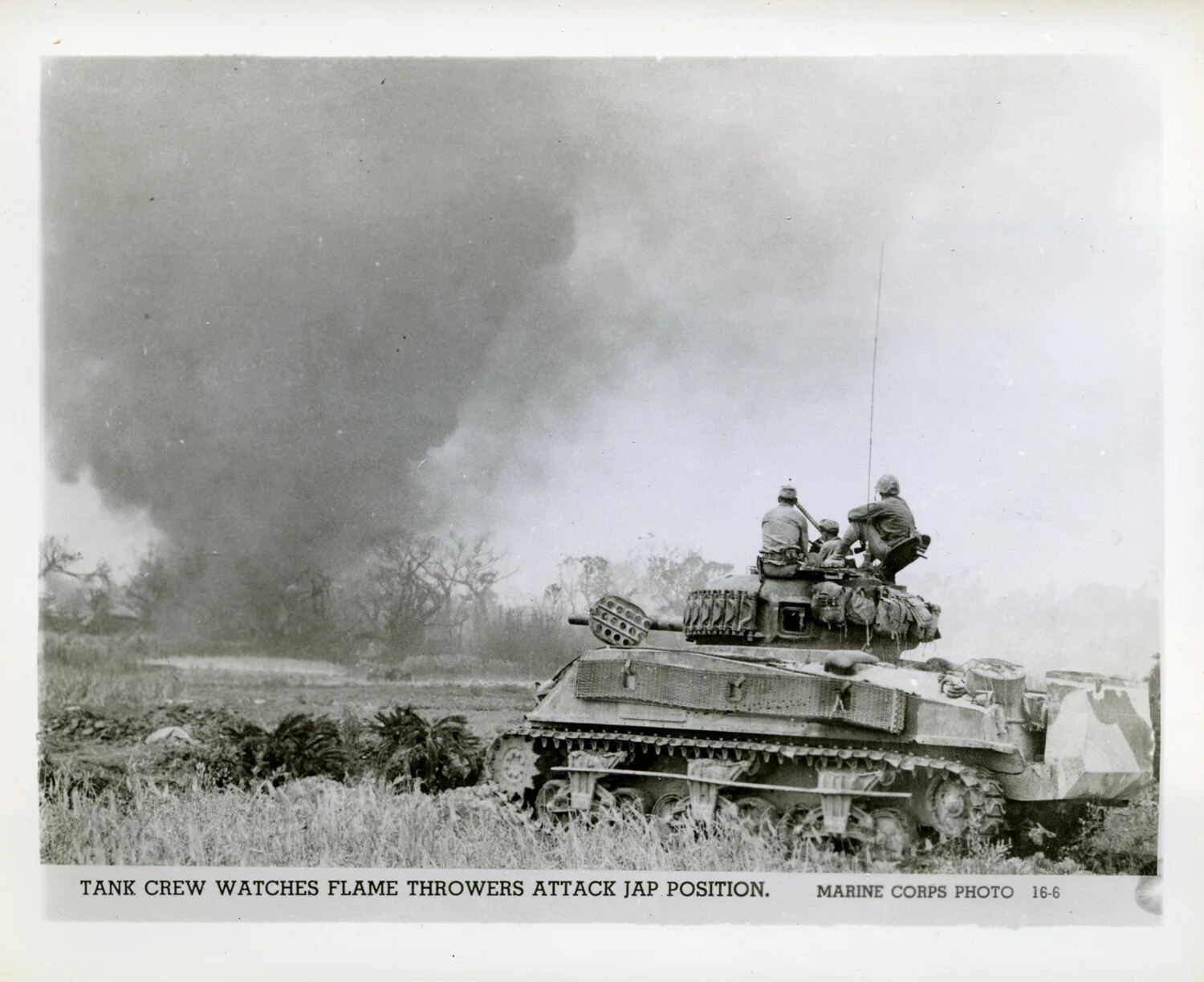 Marine Tank Crew Observes Flame-Thrower Assault on Japanese Position, Okinawa, 1945