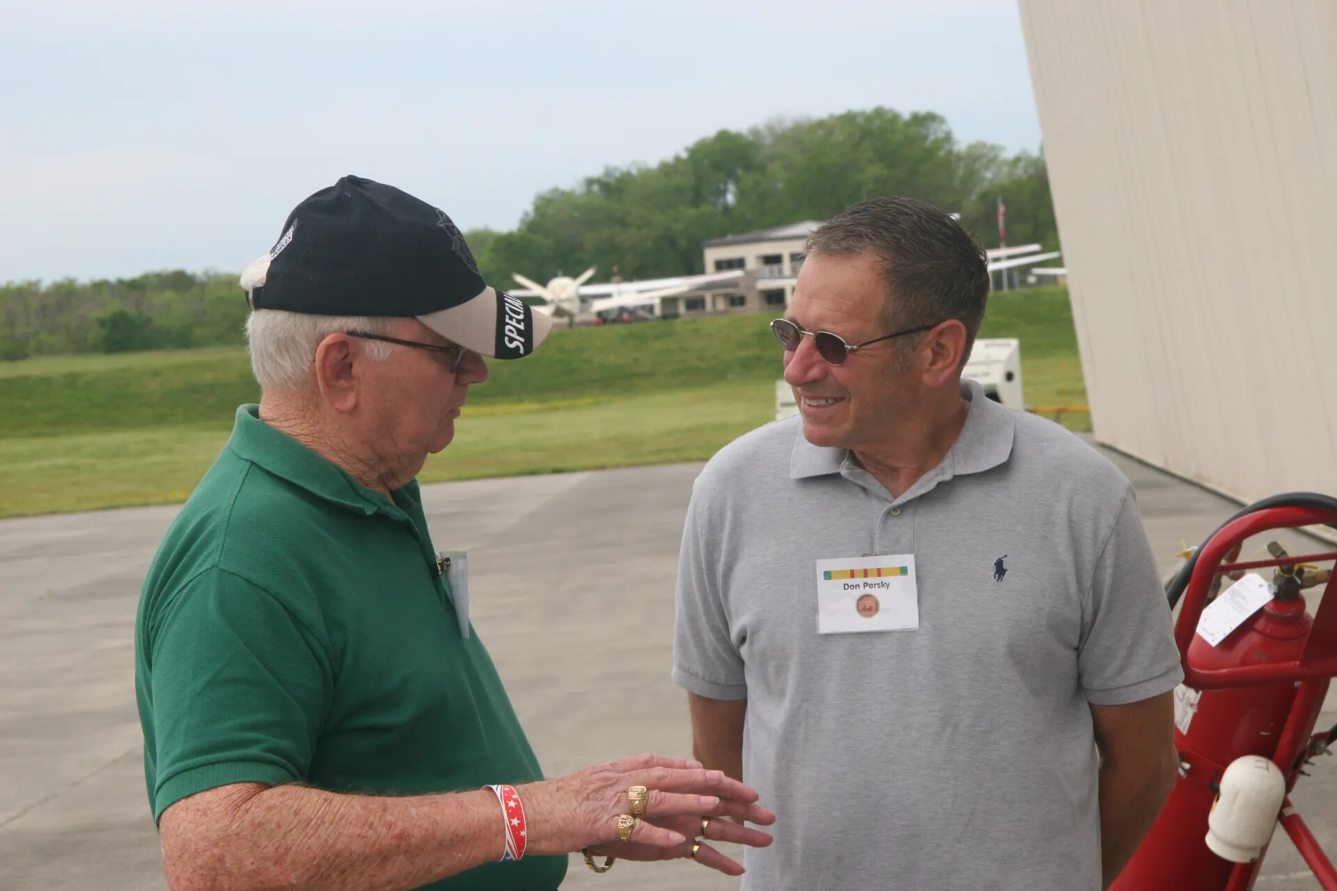 Close Portrait of Attendees 'Bernie Bright' and 'Don Persky' in Conversation