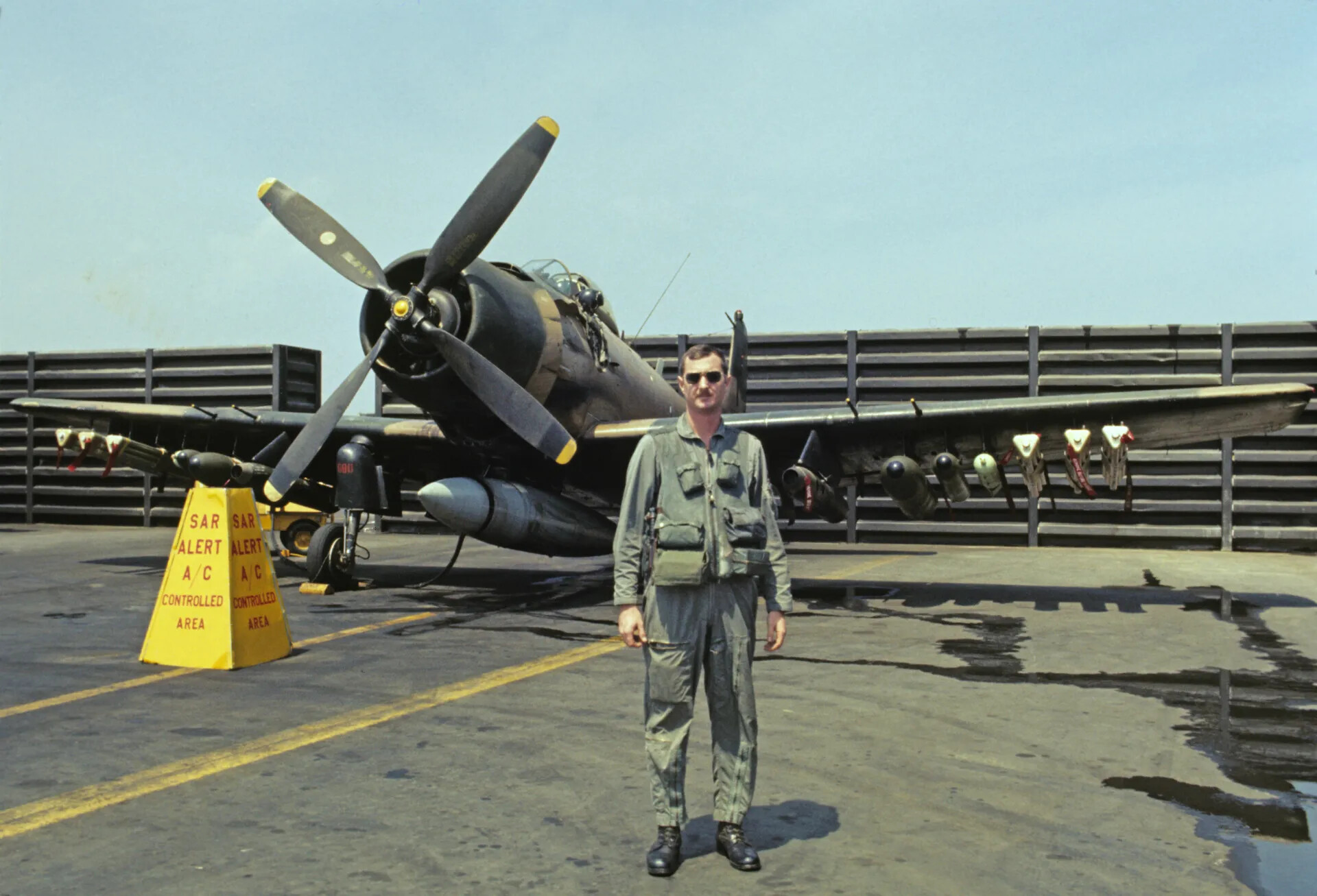 Naval Aviator Beside SAR Alert A-1 Skyraider on Carrier Deck, Vietnam War Era