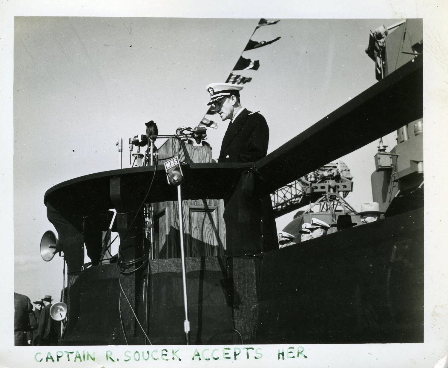 Captain R. Soucek Addresses Crowd from Podium Aboard USS Franklin D. Roosevelt (CVB-42)