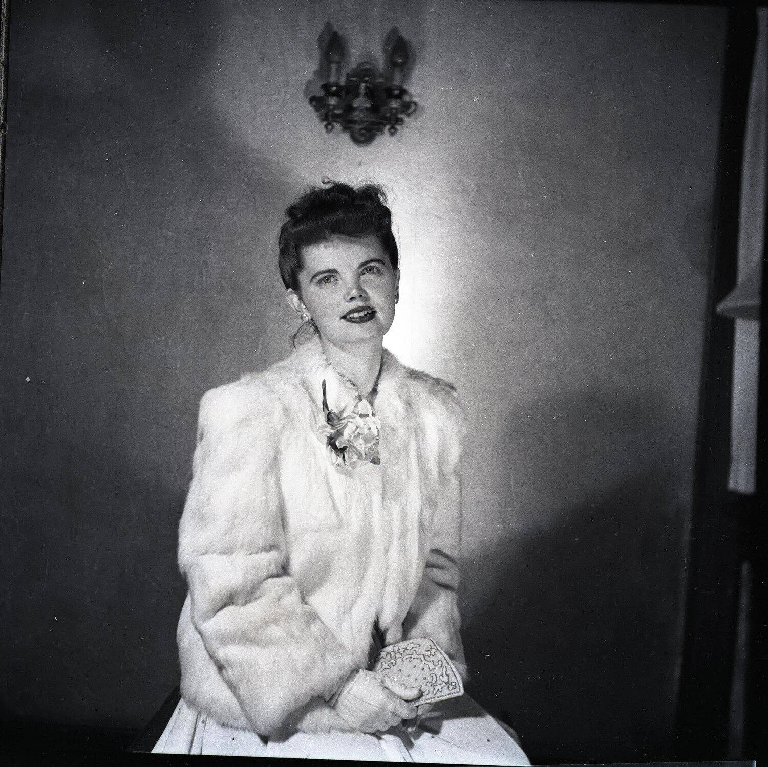 Studio Portrait of a Young Woman in Fur Jacket with Corsage, Wartime Era