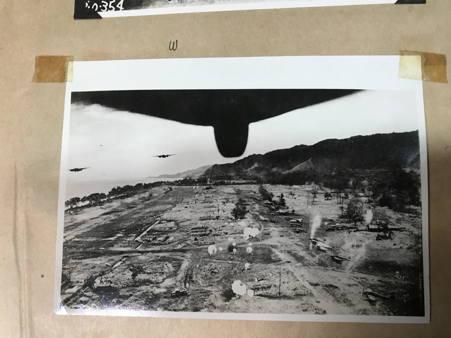 B-25 Mitchells Strafe Japanese Airfield with Parafrag Bombs, New Guinea (Full Album View)