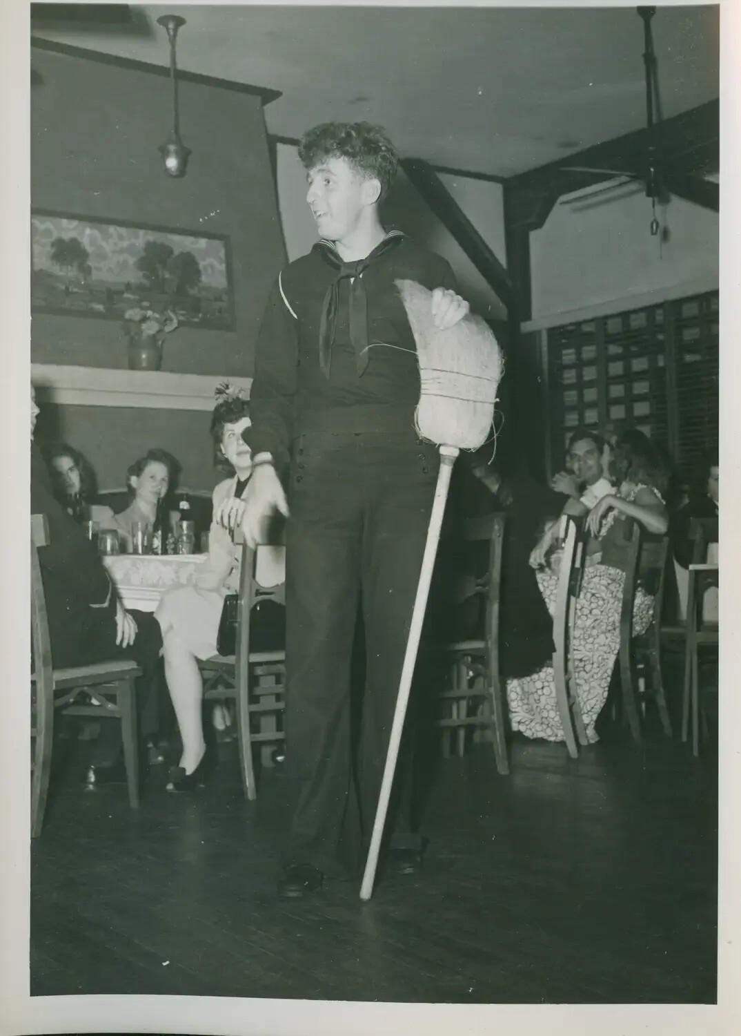 U.S. Navy Sailor Performing Comedic Mop Dance at Shipboard/Shore Party, USS Petrof Bay Collection