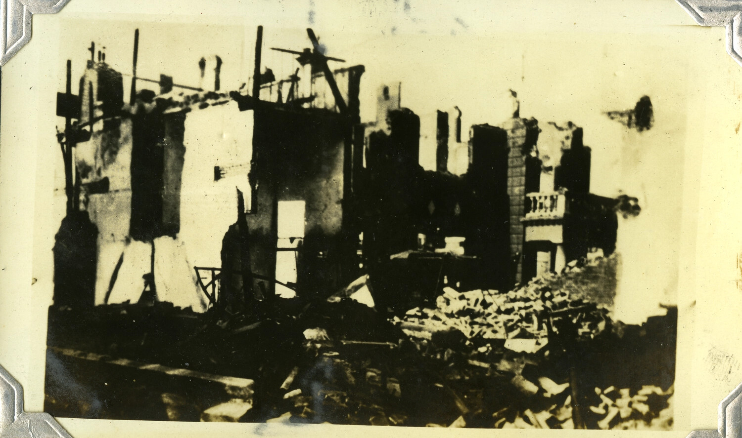 Bombed and Burned-Out City Buildings with Rubble-Filled Street, c. 1930s