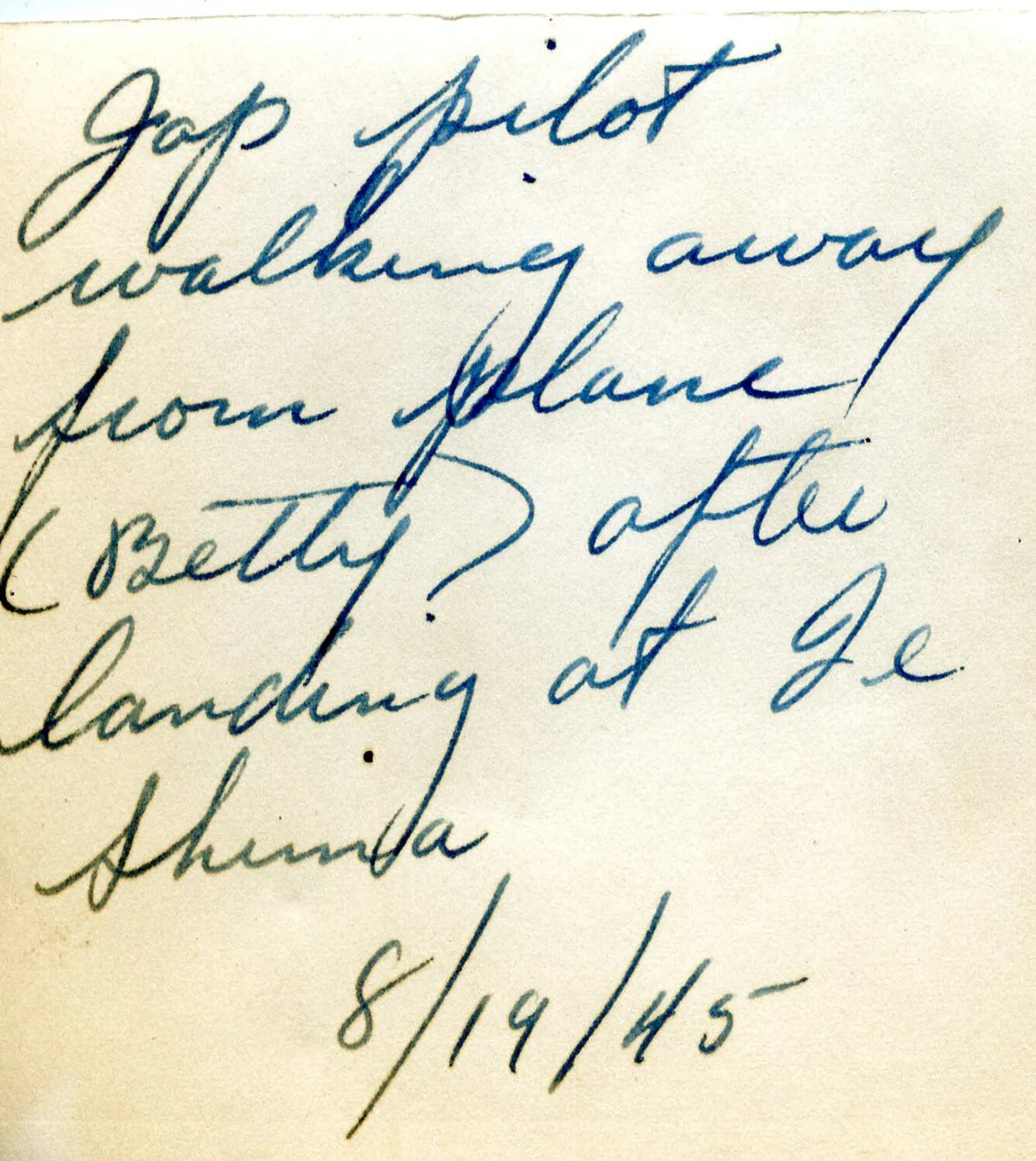 Handwritten Caption Card: 'Jap Pilot Walking Away from Plane (Betty) After Landing at Ie Shima,' August 19, 1945