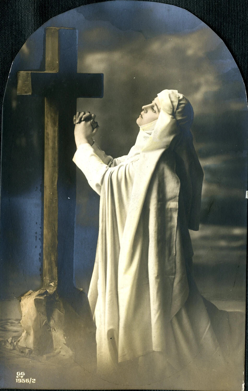Hand-Tinted Devotional Studio Photograph: Woman in Prayer Before a Wooden Cross, c. 1915-1918
