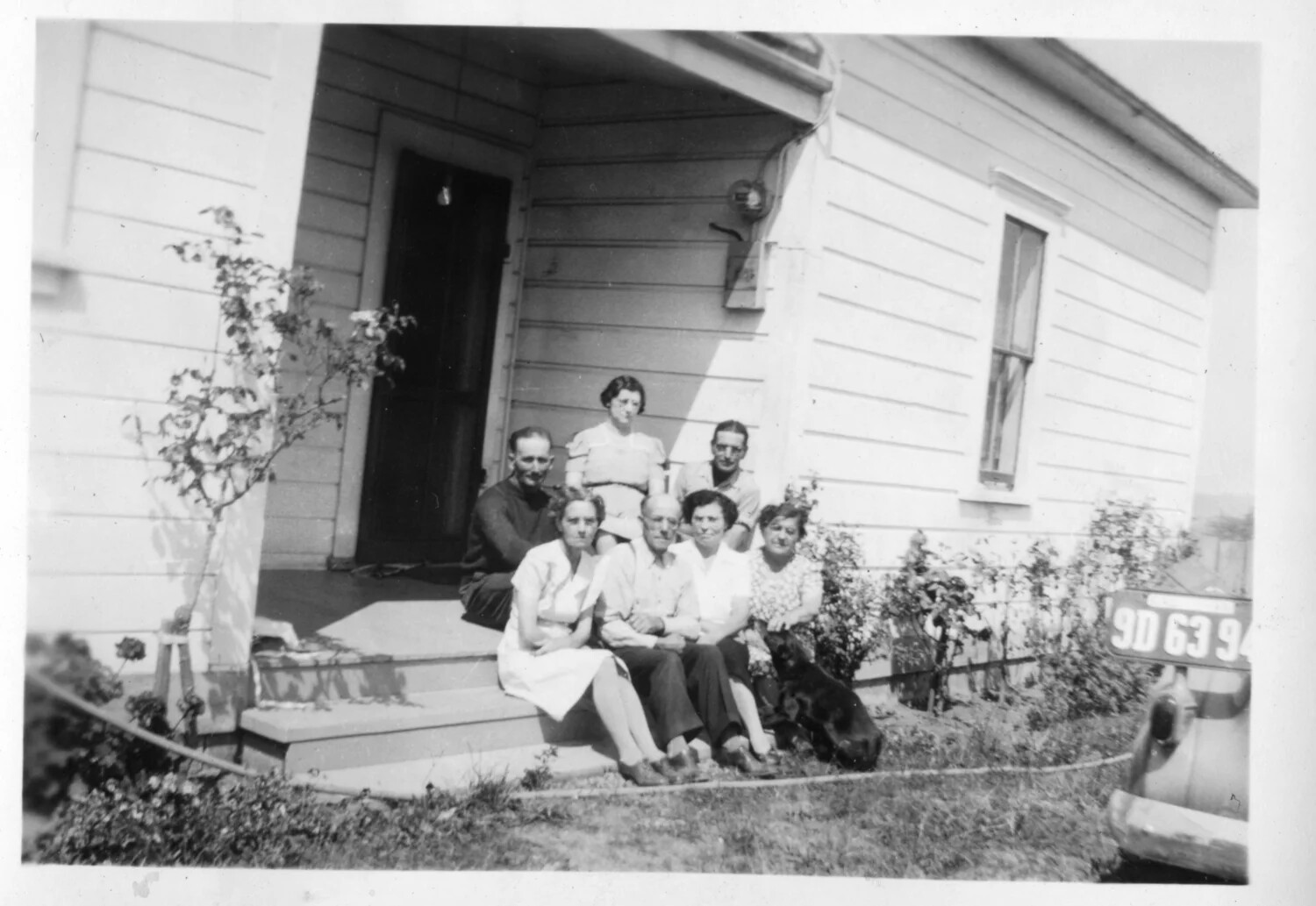 Family Group Portrait on Porch Steps with Automobile, Presidio Album, c. 1930s