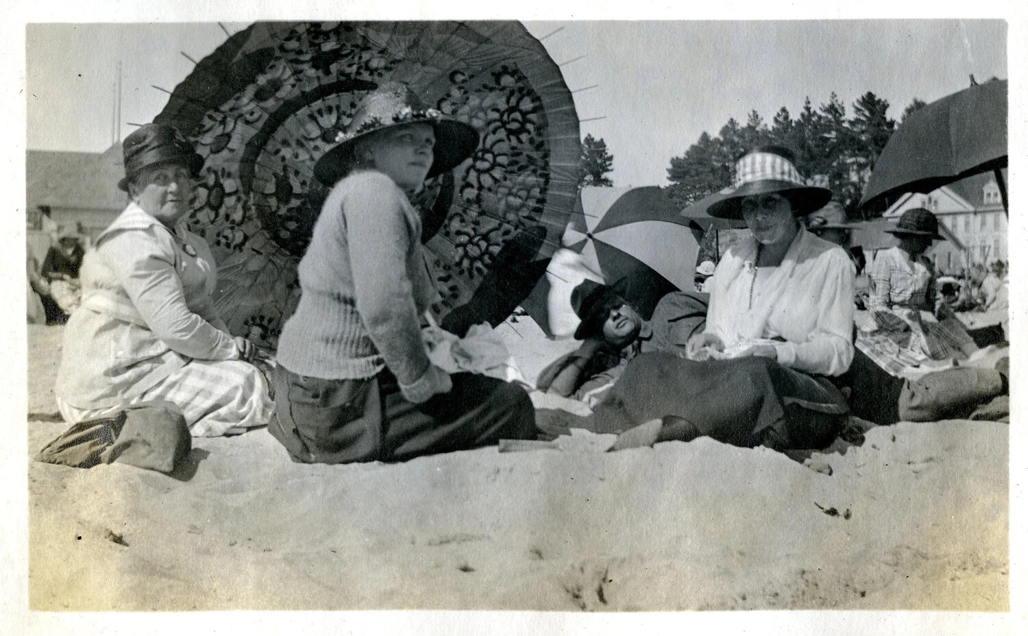 Group of Women Seated on the Beach Under Parasols, Early 20th Century