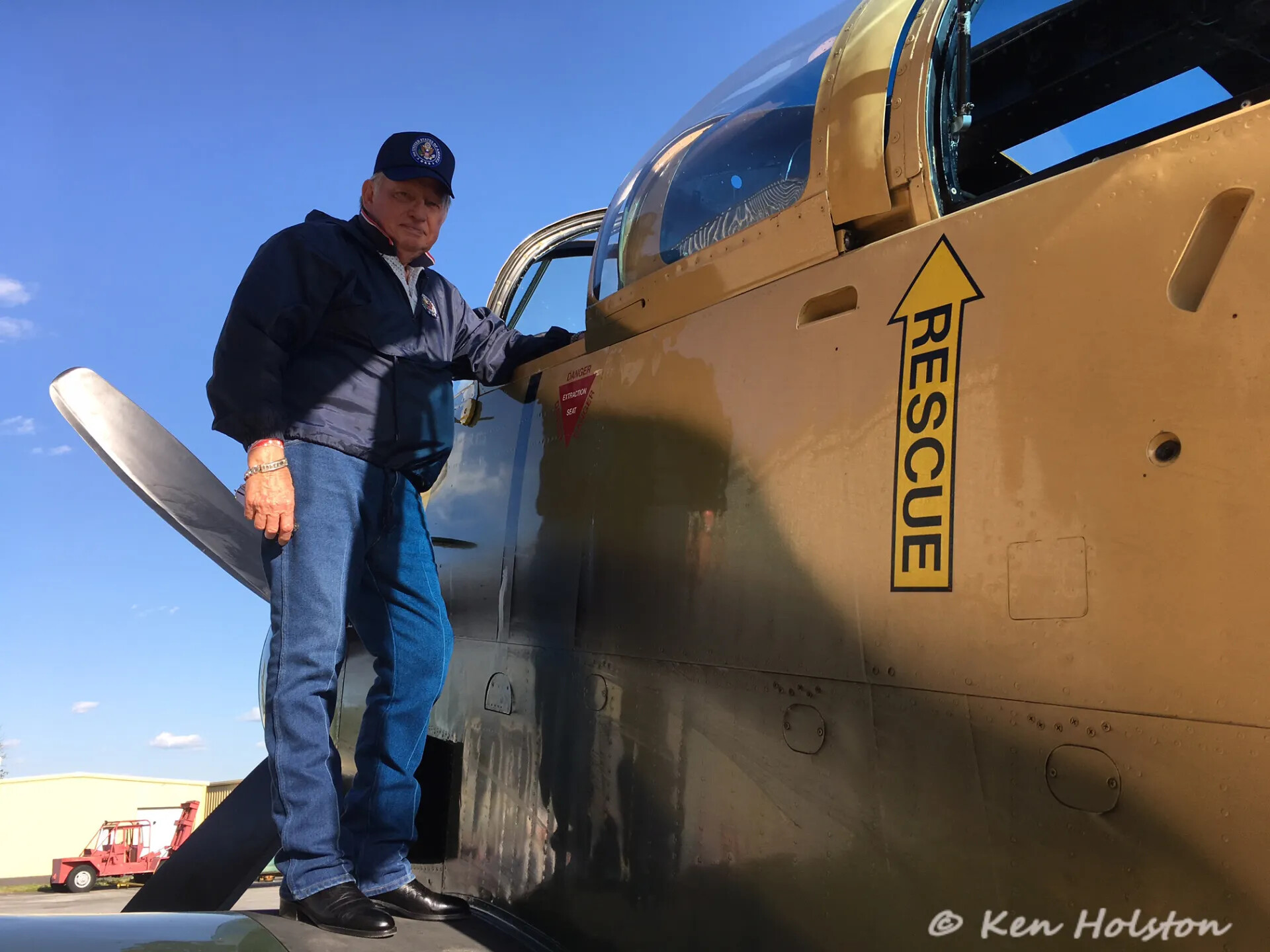 Veteran Poses on Wing of Restored A-1 Skyraider, Tailwind Day Redux Event