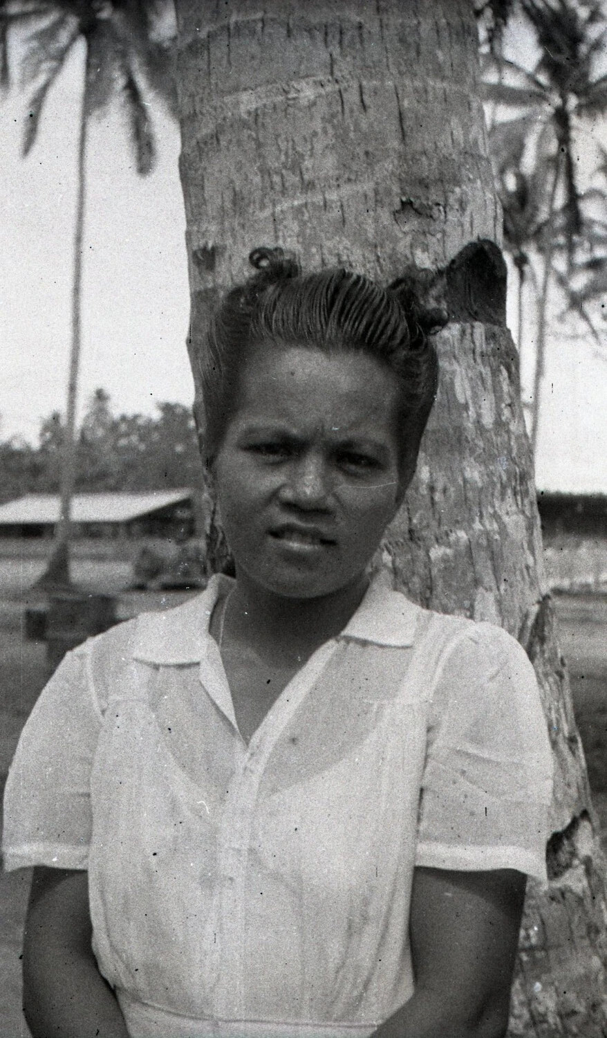 Portrait of a Filipino Woman Beside a Palm Tree, Luzon, Philippines (WWII era)